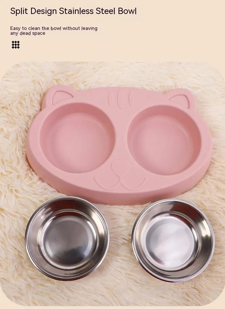 Stainless steel cat bowl with pink cat face design for feeding and drinking.