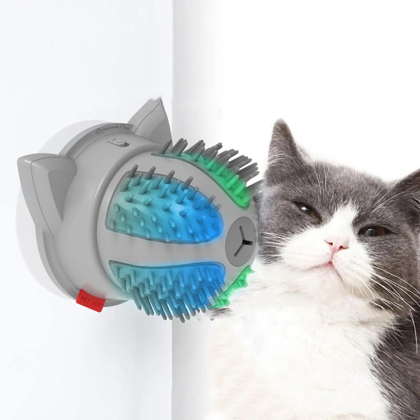 Electric pets cat brush with LED toy massager on wall, stimulating cat's interest.