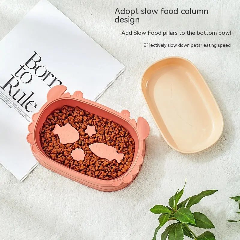 Crab-shaped slow feeding pet cat bowl in pink, featuring a removable design on a white background.