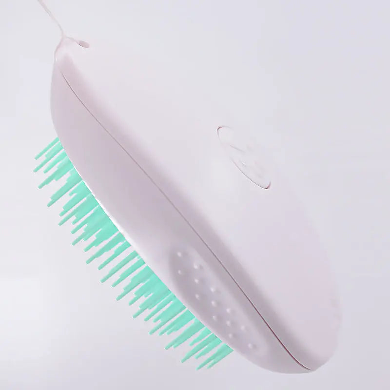 White pet brush with ABS material and green bristles for cat grooming.