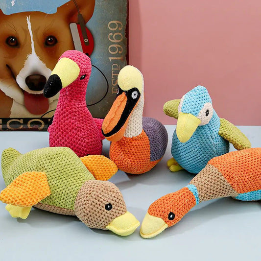 Bite resistant plush dog toys in various colors for sound play.