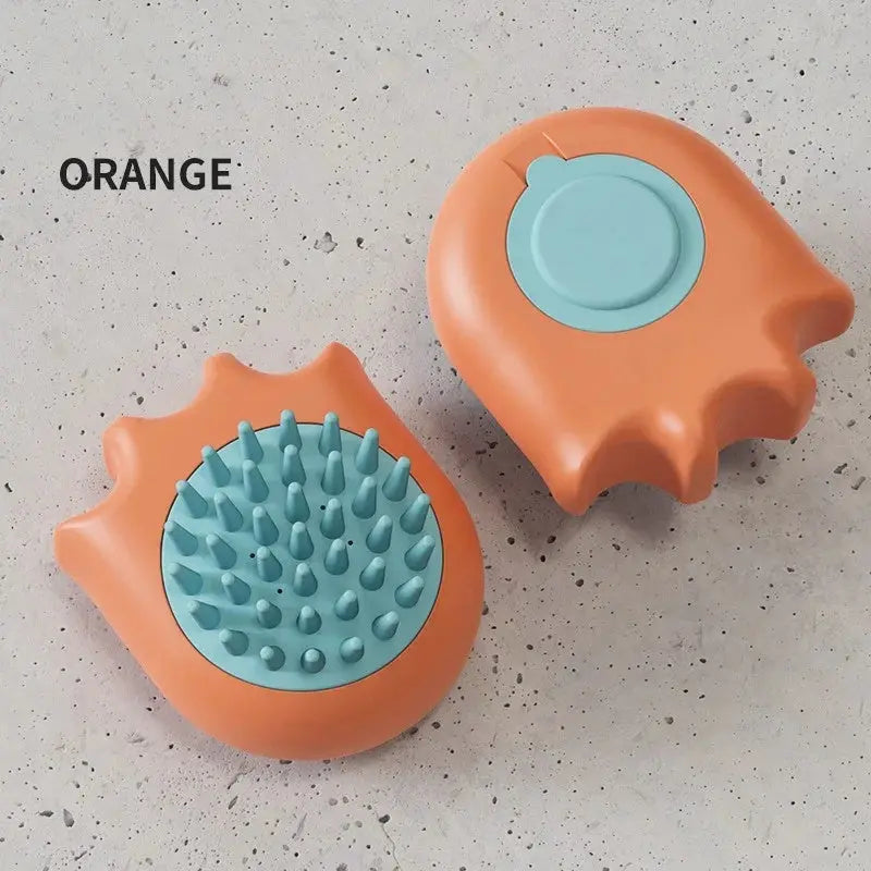 Orange pet bath brush with soft bristles for cat and dog grooming.