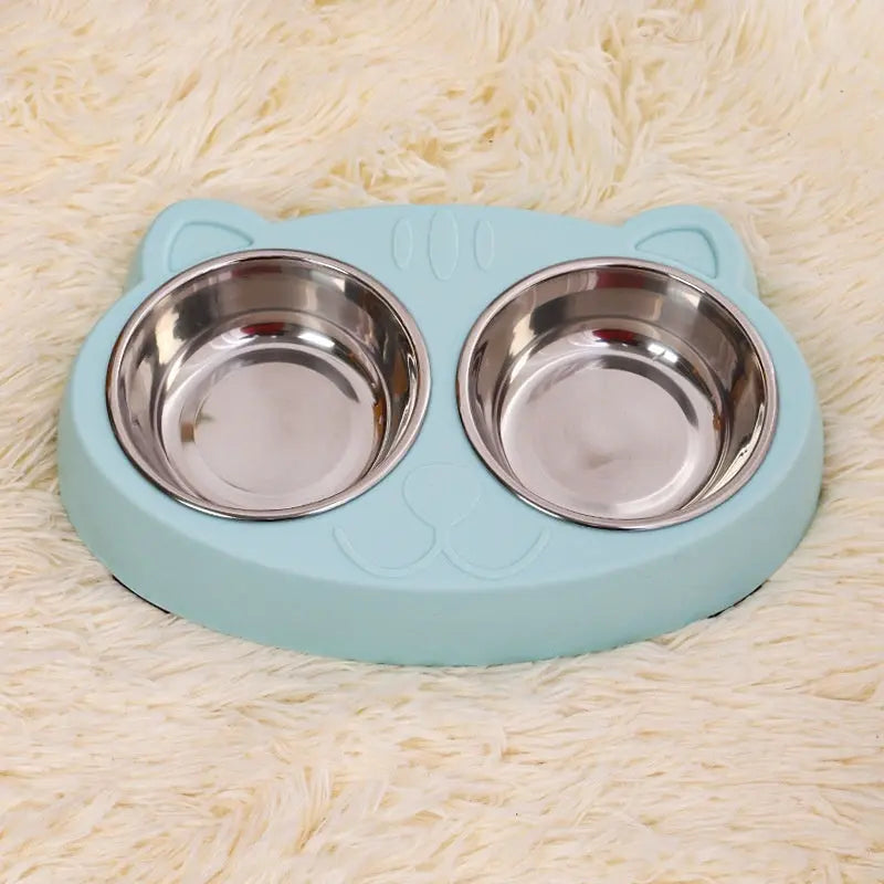 Cat bowl with stainless steel dishes on a cat face design base, available in blue, green, and pink.