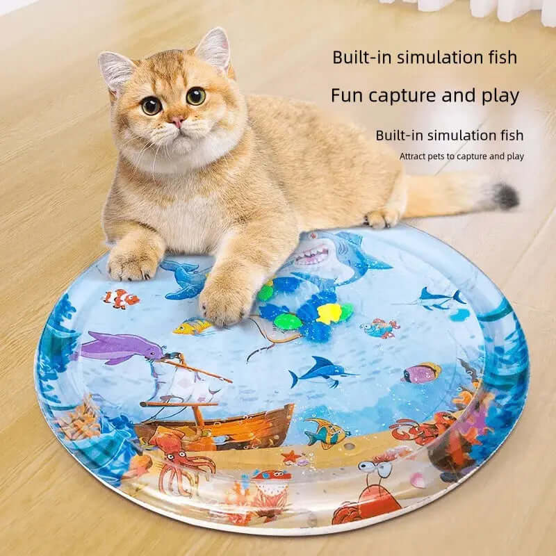 Cat lying on a vibrant fish-themed Summer Cooling Pet Water Bed, designed for sensory play and relaxation.