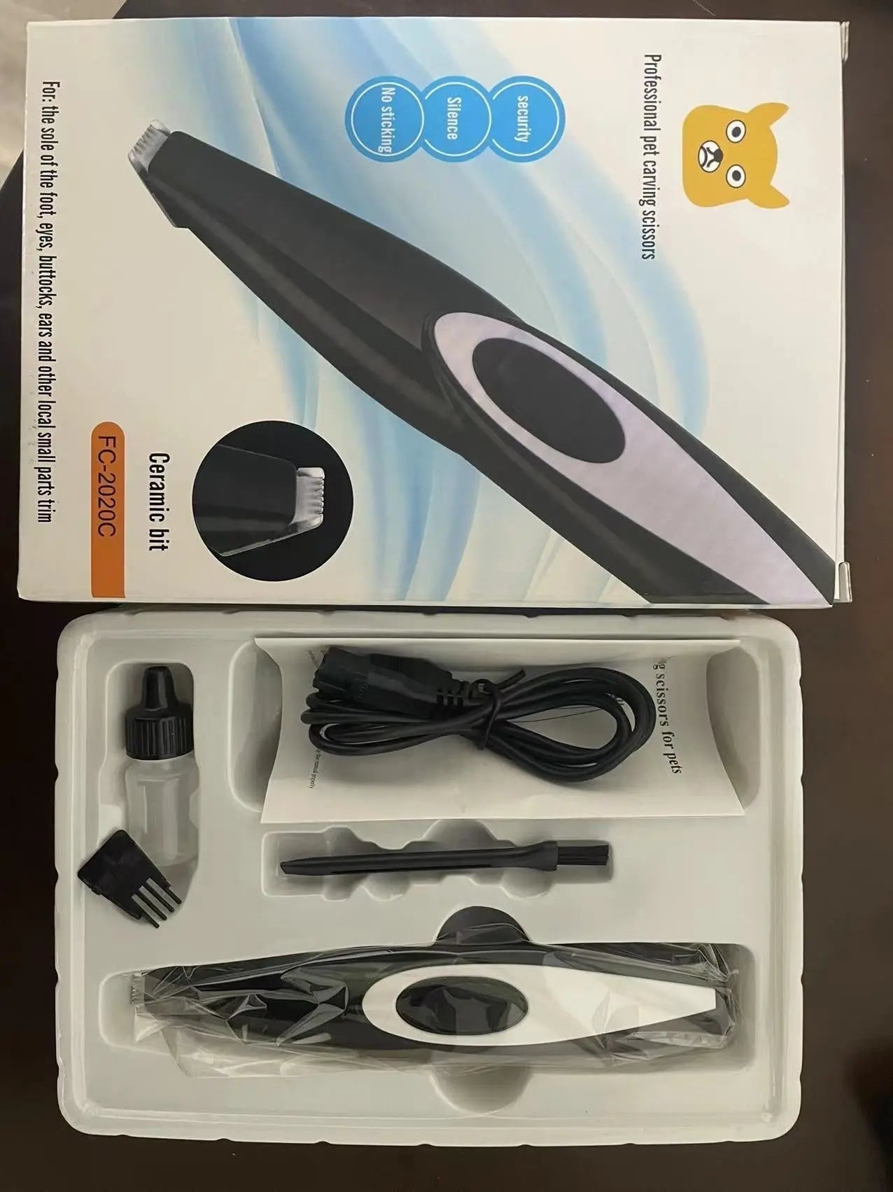 Electric pet hair clipper set with packaging, suitable for cats and dogs.