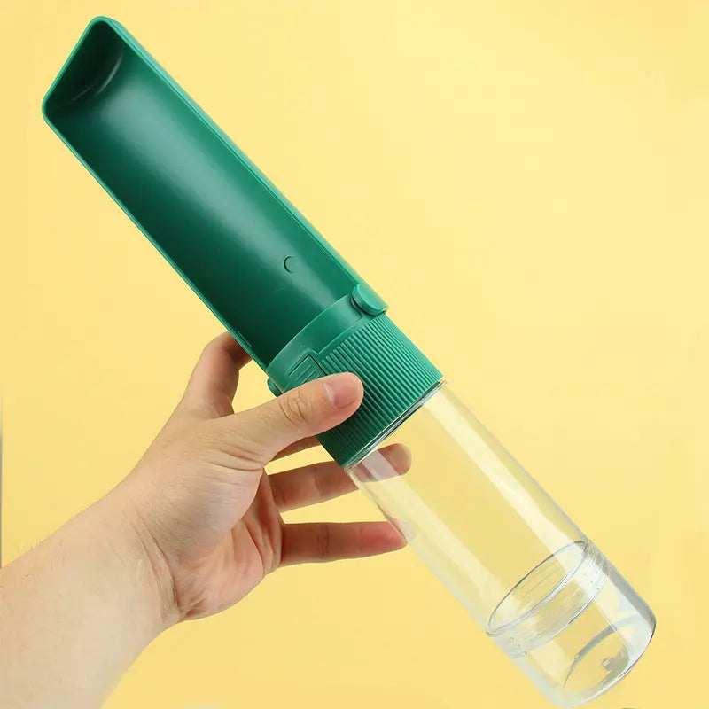 Portable pet water bottle with green drawer-style bowl design.