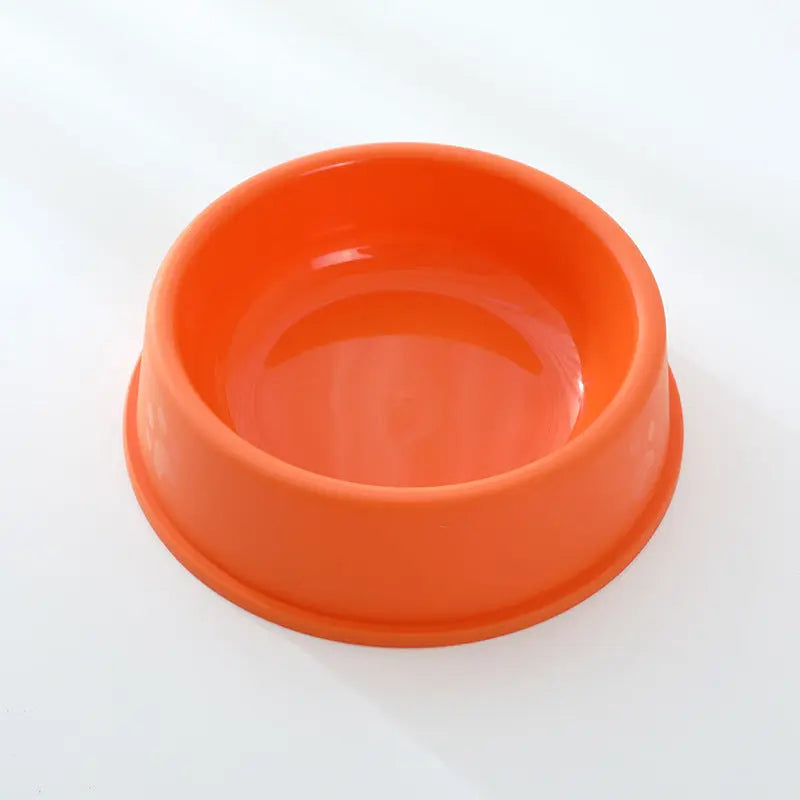 Orange plastic pet bowl with a frosted finish, ideal for feeding dogs and cats.